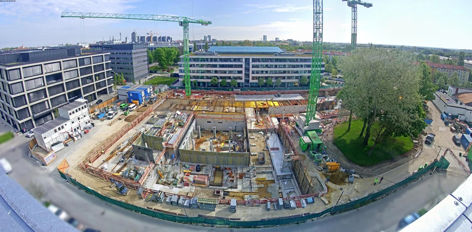 GDPR-compliant panorama shot of a large construction site with a webcam
